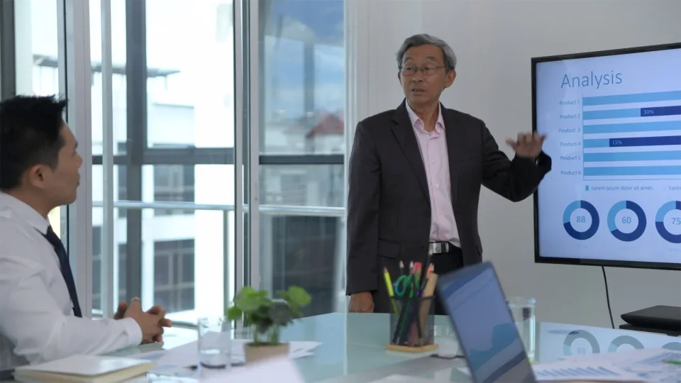 Executive presenting results to colleagues