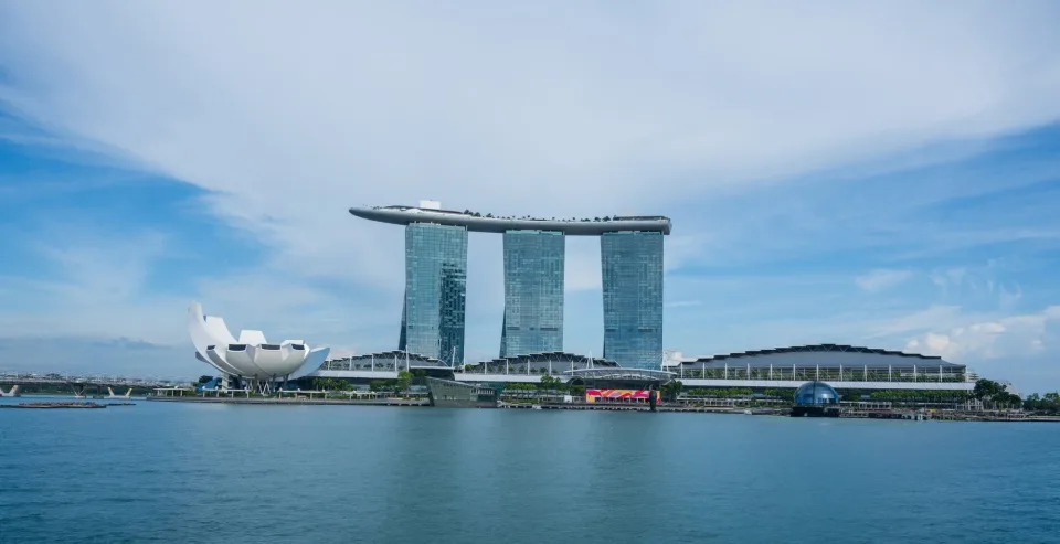 Marina Bay, Singapore, under a blue sky